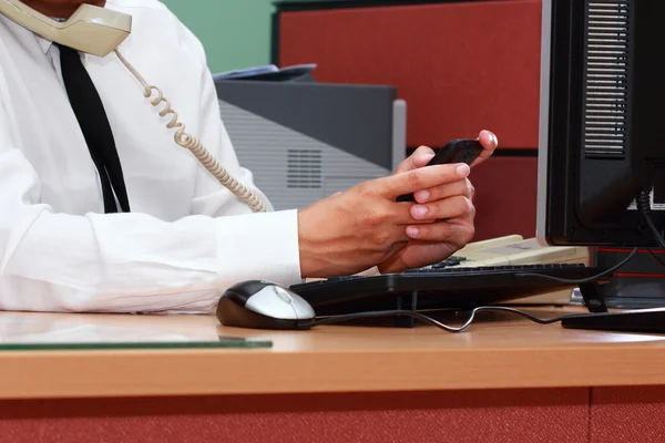 Businessman using smart phone during working — Stock Photo, Image