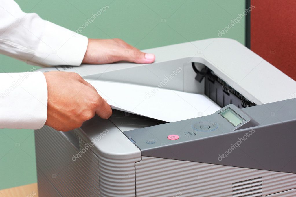 Businessman working with printer