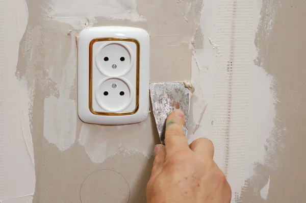 Putty near wall outlet — Stock Photo, Image