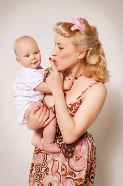 Stylization of happy pin-up girl with baby — Stock Photo, Image