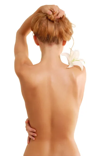 Espalda de chica hermosa desnuda con flor —  Fotos de Stock