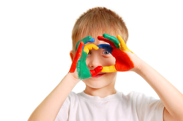 Boy with hands in paint