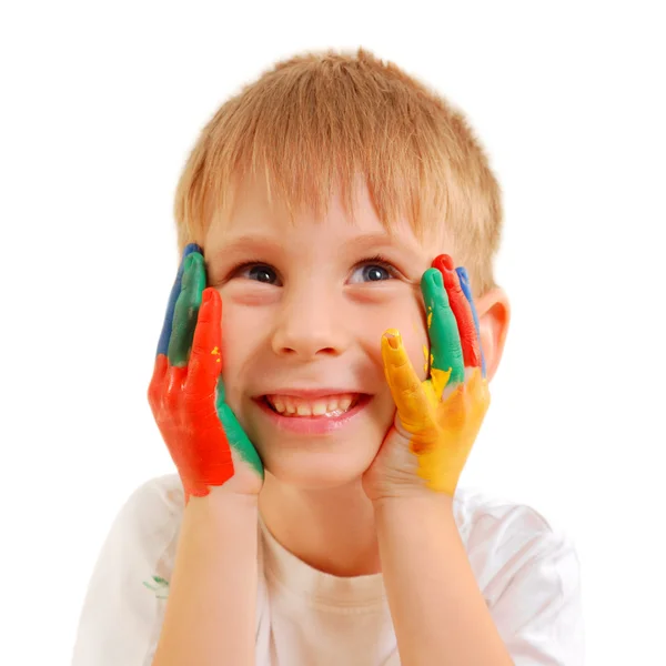 Sevimli küçük çocuk ellerinde boya ile — Stok fotoğraf