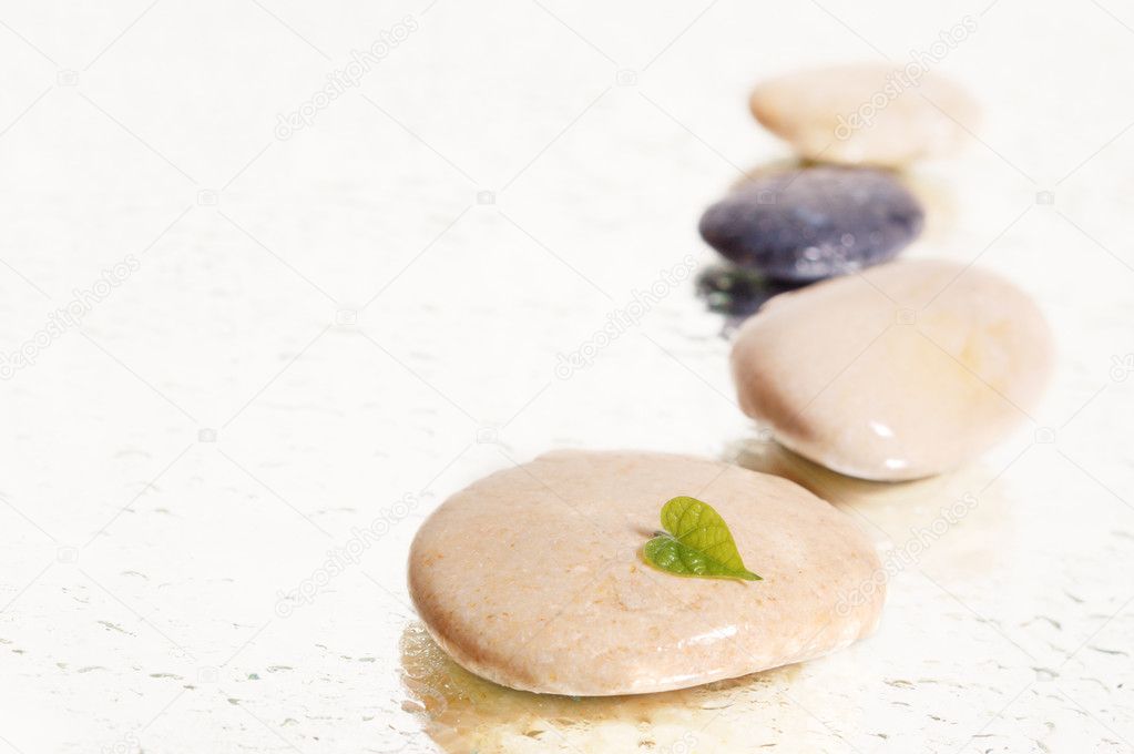 Spa stones with pink orchid