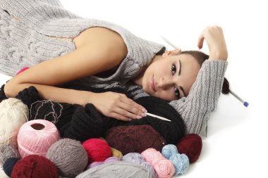 Woman finish knitting sweater clipart