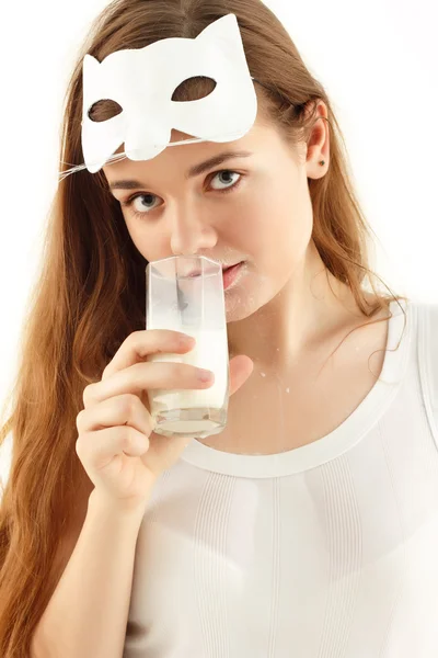 Teenager girl drinking milk with cat mask — Stock Photo, Image