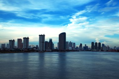 Waterfront high-rise buildings in Bangkok. clipart