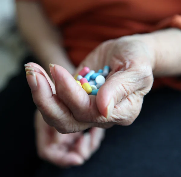 stock image Close up of old hands with tablets