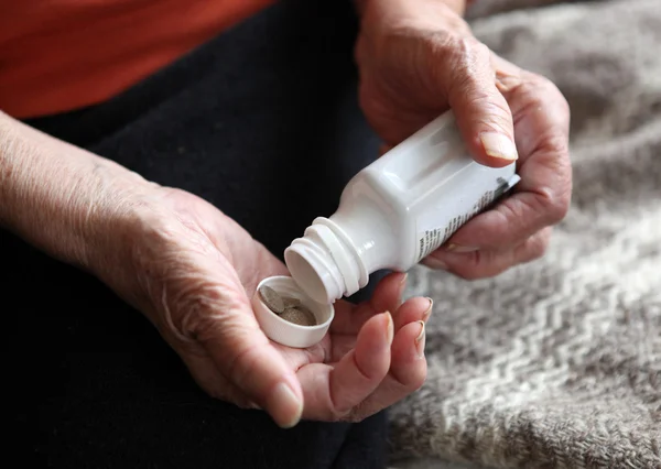 stock image Close up of old hands with tablets