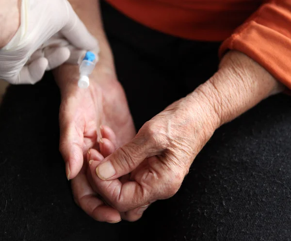 stock image Close up of old hands with tablets