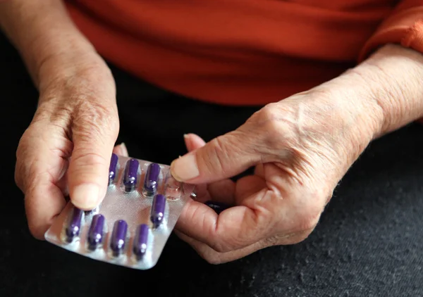 stock image Close up of old hands with tablets