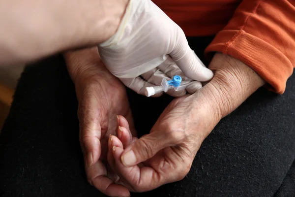 stock image Close up of old hands with tablets