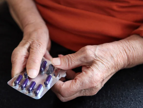 stock image Close up of old hands with tablets