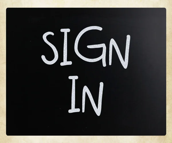 "sign in" handwritten with white chalk on a blackboard — Stock Photo, Image
