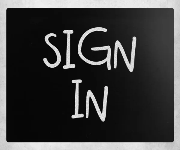 "sign in" handwritten with white chalk on a blackboard — Stock Photo, Image