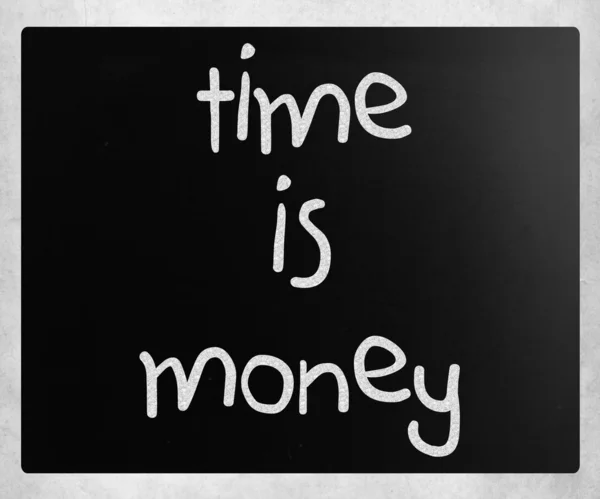 "Time is money" handwritten with white chalk on a blackboard — Stock Photo, Image