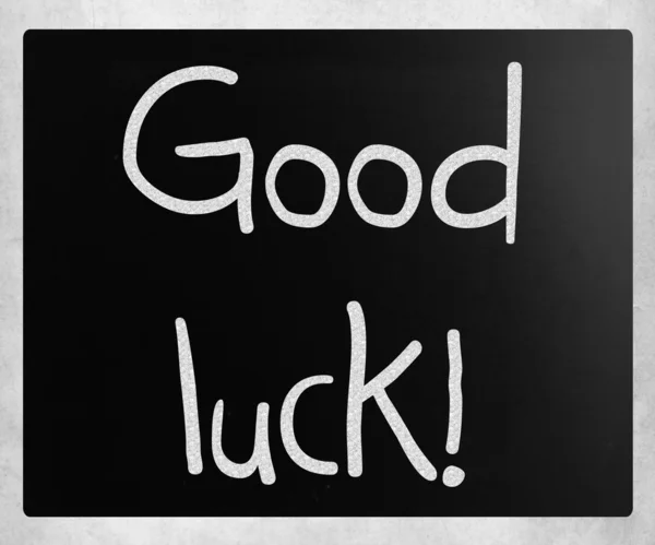 "Good luck!" handwritten with white chalk on a blackboard — Stock Photo, Image