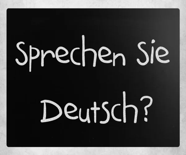 "Sprechen SIE Deutsch? "handskriven med vit krita på en låginkomst — Stockfoto