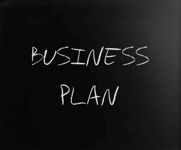 "Business plan" handwritten with white chalk on a blackboard — Stock Photo, Image