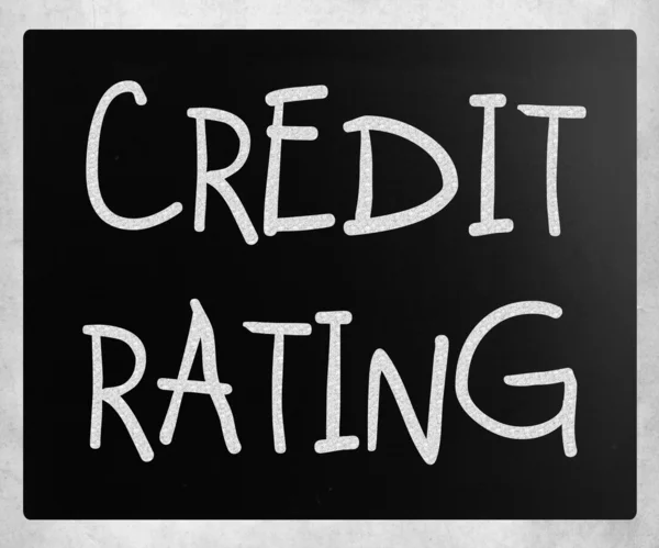 "Credit rating" handwritten with white chalk on a blackboard — Stock Photo, Image