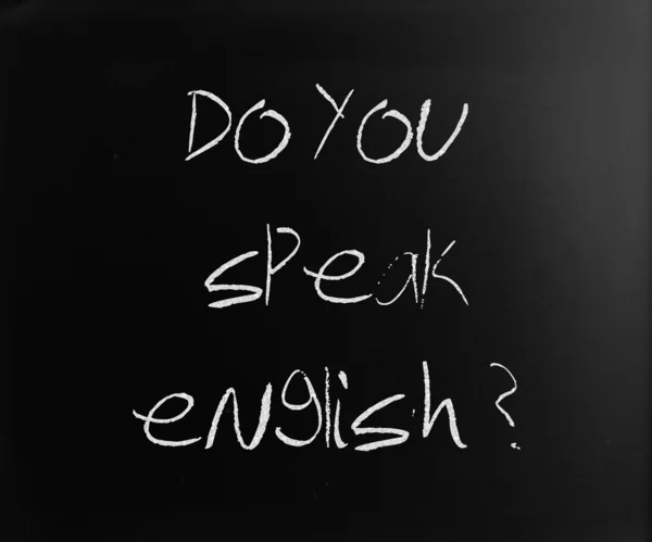 "Beszél angolul "kézzel írott, fehér kréta egy blackbo — Stock Fotó
