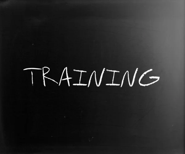 "Training "handwritten with white chalk on a blackboard — стоковое фото