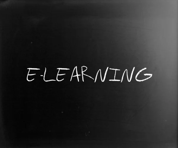 "E-learning" handwritten with white chalk on a blackboard — Stock Photo, Image