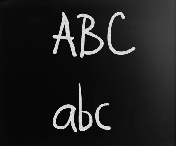 "ABC" handwritten with white chalk on a blackboard — Stock Photo, Image