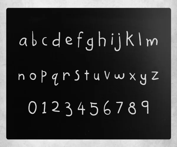 "Alphabet "handwritten with white chalk on a blackboard — стоковое фото