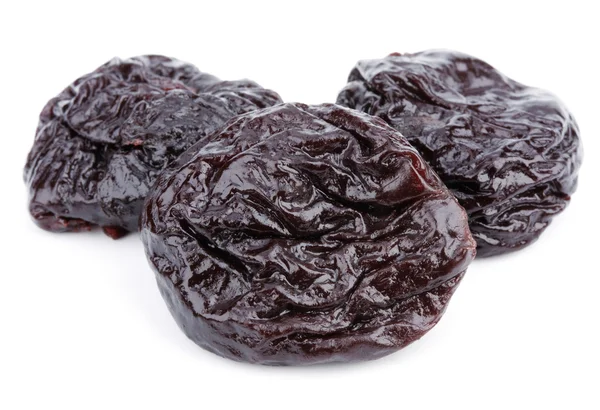 Dried plum fruits - prunes on white — Stock Photo, Image