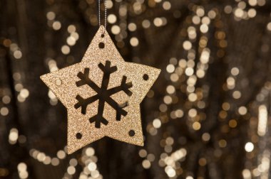 Artificial Snowflake in gold clipart