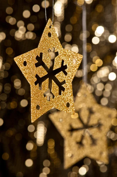 Artificial Snowflake in gold — Stock Photo, Image