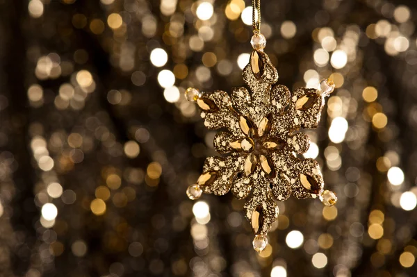 Artificial Snowflake in gold Royalty Free Stock Images