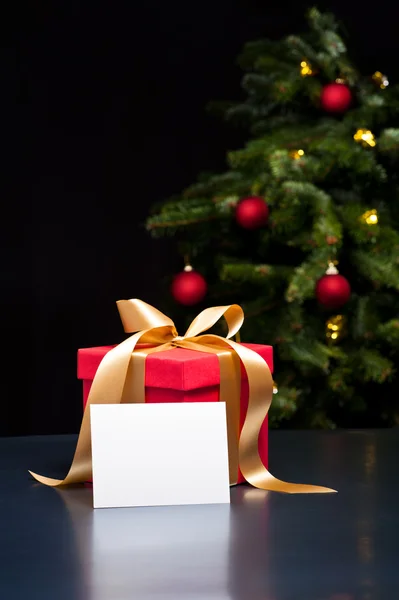 Christmas present with white card — Stock Photo, Image