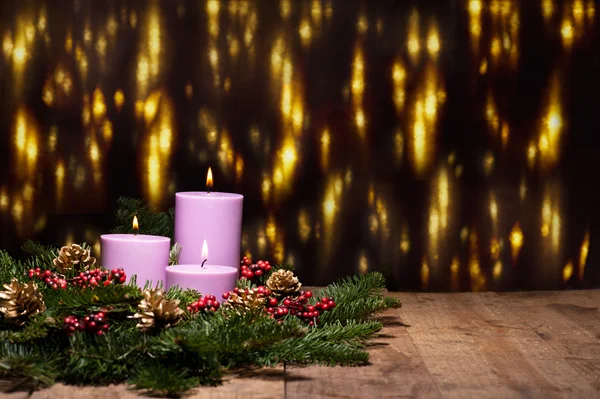 Three candles in an advent flower arrangement — Stock Photo, Image