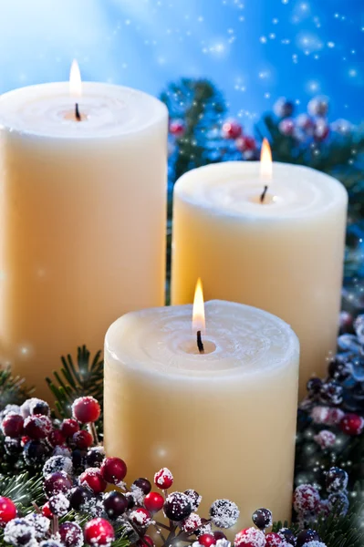 Три свічки зі снігопадами — стокове фото