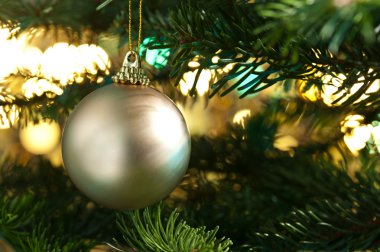 Decorative gold bauble in a Christmas tree clipart