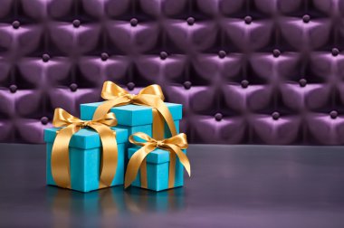 Present in front of a button tufted background clipart