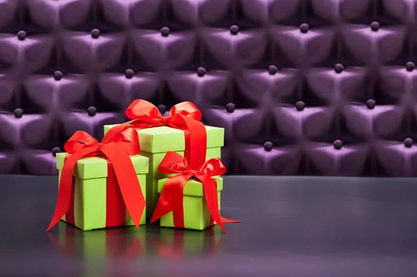 Gift or Present in front of a button tufted background — Stock Photo, Image