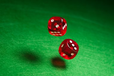 Rolling red dice clipart