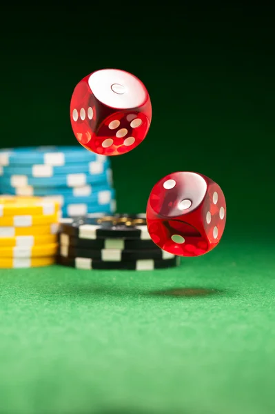 Rolling red dice — Stock Photo, Image