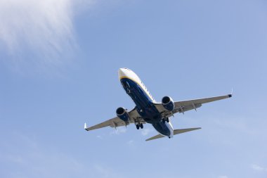 Boeing 737 makes its landing approach to oporto clipart