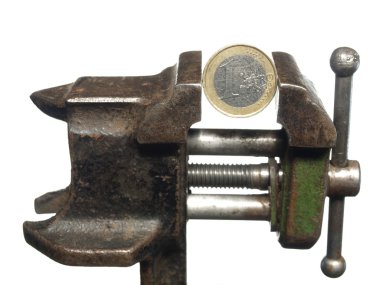 Shabby coin in one euro is clamped in the old vice, isolated on clipart