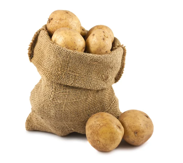 Batatas em saco de serapilheira — Fotografia de Stock