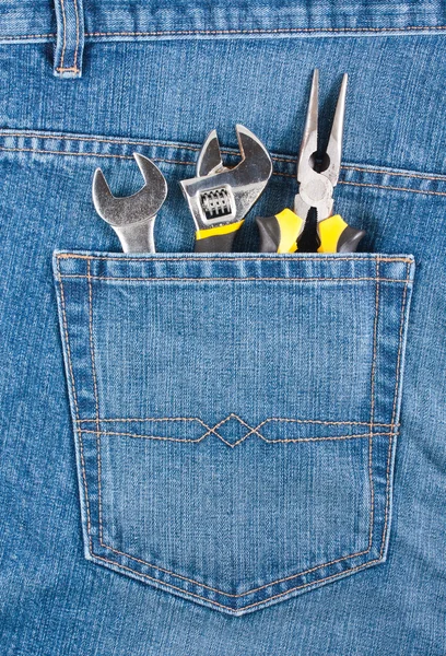 Várias ferramentas no bolso jeans — Fotografia de Stock