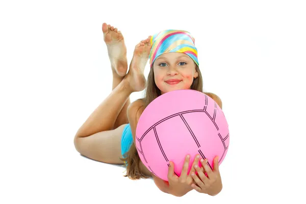 Cute little girl in swimming suit with a ball, isolated on a white background — Stock Photo, Image