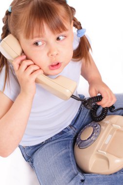 Little girl calling the old phone clipart