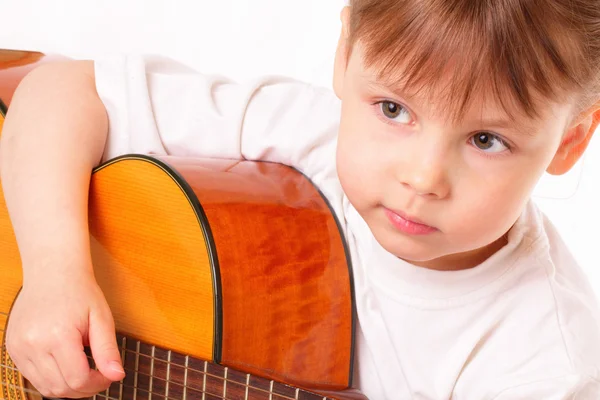 Beautiful little girl plays guitar — Stock Photo, Image
