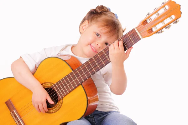 Funny little girl plays guitar — Stock Photo, Image