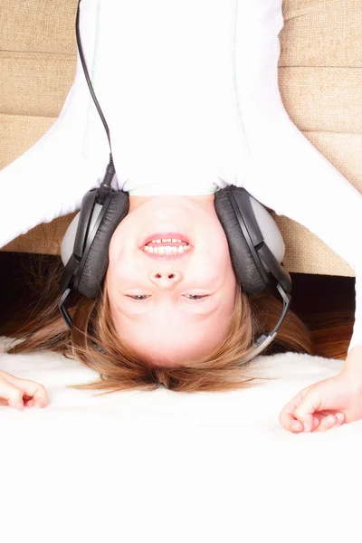 Beautiful little girl with headphones — Stock Photo, Image